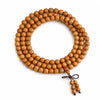 Aged peach wood 108-bead mala arranged in loops for prayer and meditation