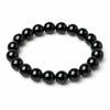 Simple black obsidian bead bracelet on a white background