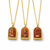 Three gold-tone ghau-style necklace lockets with thangka imagery