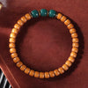 Buddha Tibet Olive Pit Talisman - Turquoise, Dzi & Cinnabar