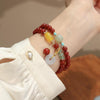 Red Agate Double-Loop Bracelet — Peace Knot, Worn in Two Strands