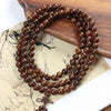 Golden Silk Sandalwood Mala Bracelet — Natural Wood Beads with Carved Blessing Pendant Buddha Tibet