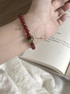 Red Agate & Jadeite Running Ring Bracelet — A Loose Green Ring on a Red Strand