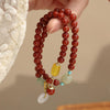 Red Agate Double-Loop Bracelet — Peace Knot, Worn in Two Strands