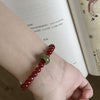 Red Agate & Jadeite Running Ring Bracelet — A Loose Green Ring on a Red Strand