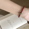Red Agate & Jadeite Running Ring Bracelet — A Loose Green Ring on a Red Strand