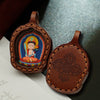 Hand-Painted Tsatsa Pendant — Miniature Tibetan Buddhist Guardian in Leather Frame Buddha Tibet