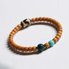 Buddha Tibet Olive Pit Talisman - Turquoise, Dzi & Cinnabar