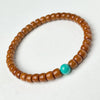 Buddha Tibet Olive Pit Talisman - Turquoise, Dzi & Cinnabar