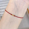 Gold Möbius Red String Bracelet — Adjustable Luck Charm for the Year of Your Birth - Möbius Ring — Red Cord, AdjustableBuddha Tibet