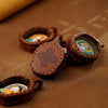 Hand-Painted Tsatsa Pendant — Miniature Tibetan Buddhist Guardian in Leather Frame Buddha Tibet