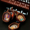 Hand-Painted Tsatsa Pendant — Miniature Tibetan Buddhist Guardian in Leather Frame Buddha Tibet