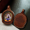 Hand-Painted Tsatsa Pendant — Miniature Tibetan Buddhist Guardian in Leather Frame Buddha Tibet