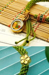 Tibetan Fortune Eye Braided Bracelet — Woven Lucky Cord with Dharma Eye Charm & Prayer Wheel Bead Buddha Tibet