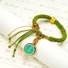 Tibetan Fortune Eye Braided Bracelet — Woven Lucky Cord with Dharma Eye Charm & Prayer Wheel Bead Buddha Tibet