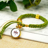Tibetan Fortune Eye Braided Bracelet — Woven Lucky Cord with Dharma Eye Charm & Prayer Wheel Bead Buddha Tibet